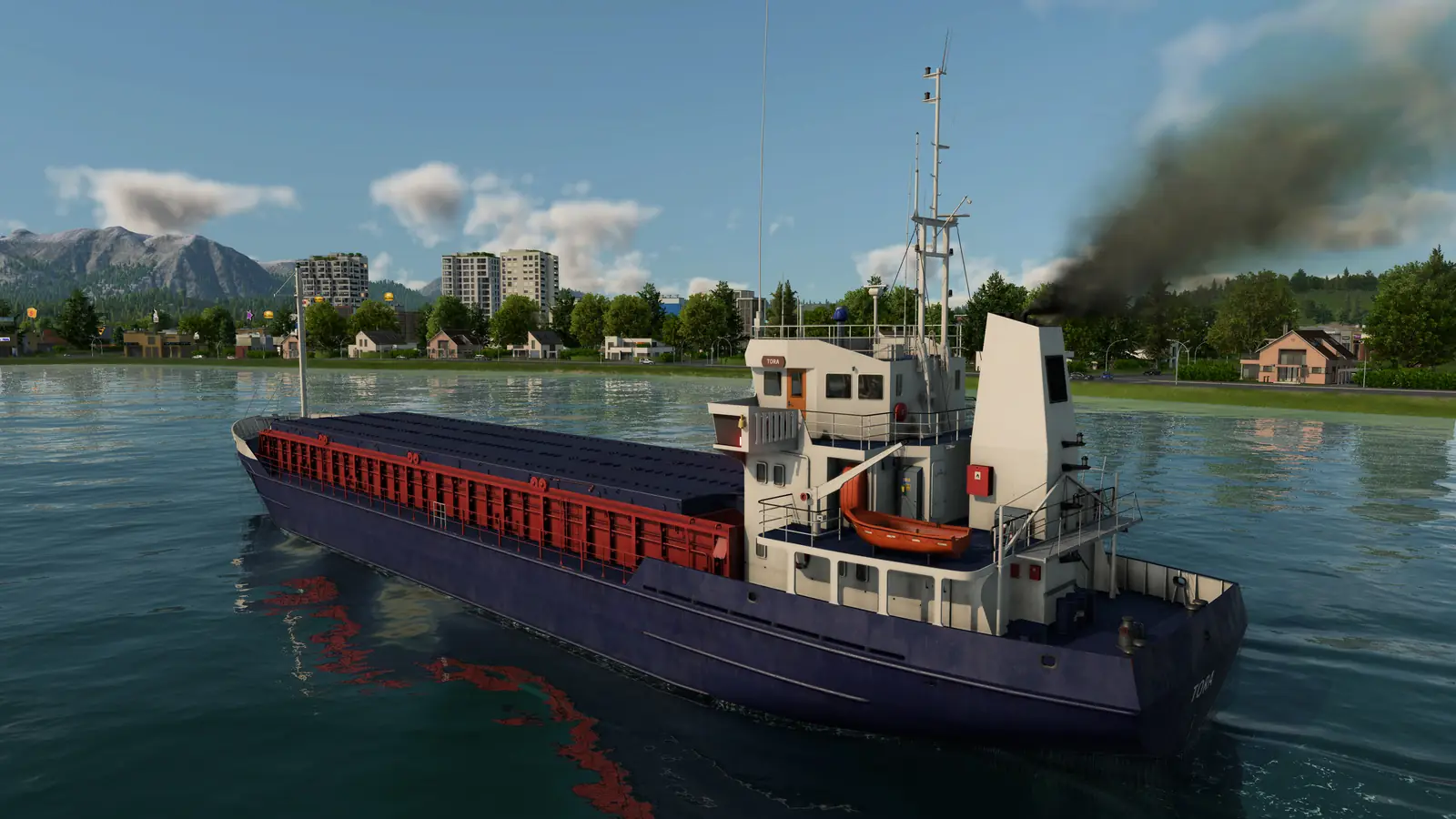 A large Transport Fever 3 cargo ship with a red deck and a white bridge sailing close to a green shore, with a town and mountains behind