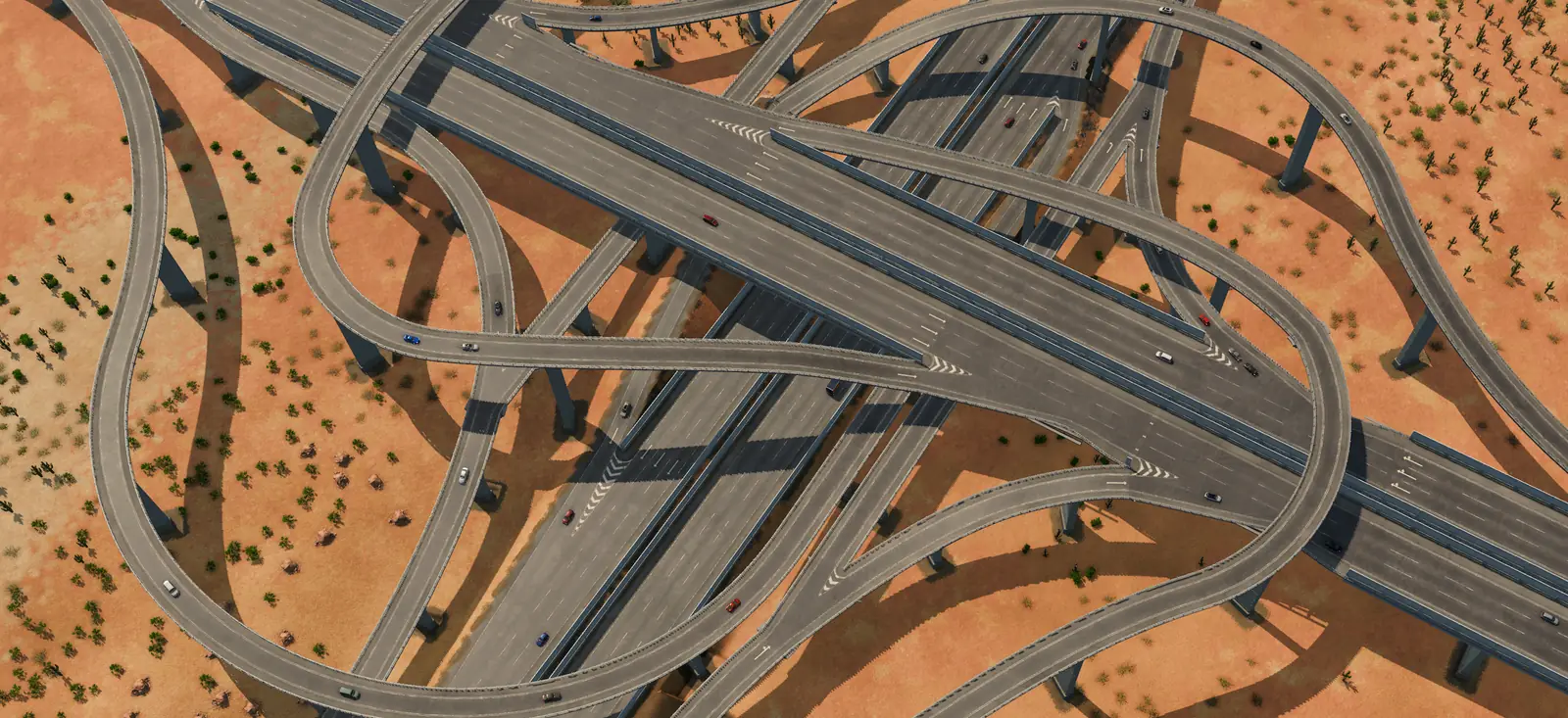 A large Transport Fever 3 highway interchange in the desert seen from above, with flyovers, curving ramps and cars on several levels