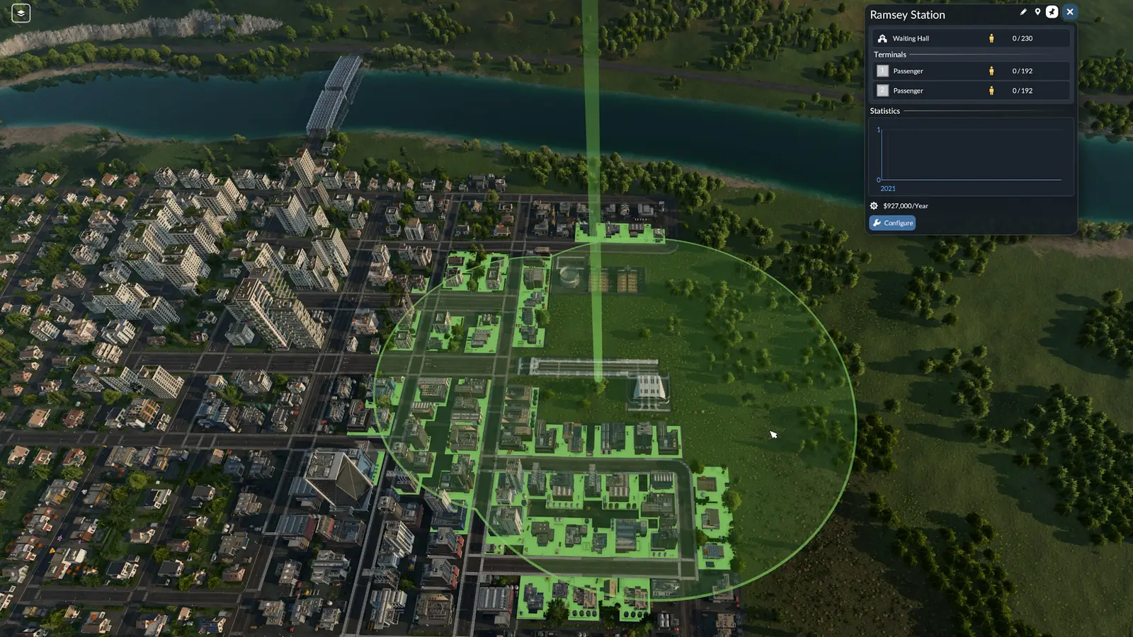 A selected Transport Fever 3 station showing its circular catchment area, with the town buildings inside it tinted green