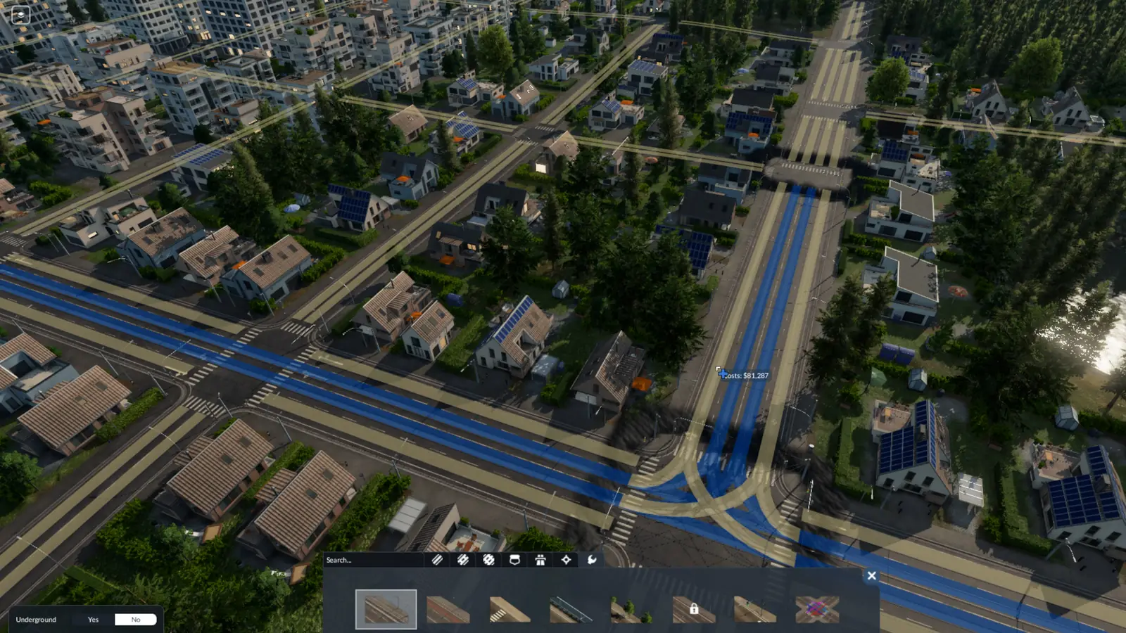 The Transport Fever 3 street menu on its Tools tab with the tram track tool picked, over a town whose streets are highlighted in blue and yellow, with the cost shown next to the cursor